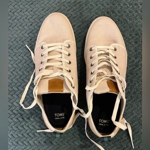 Men’s size 10 Tom’s sneakers. Cream with brown leather accent.